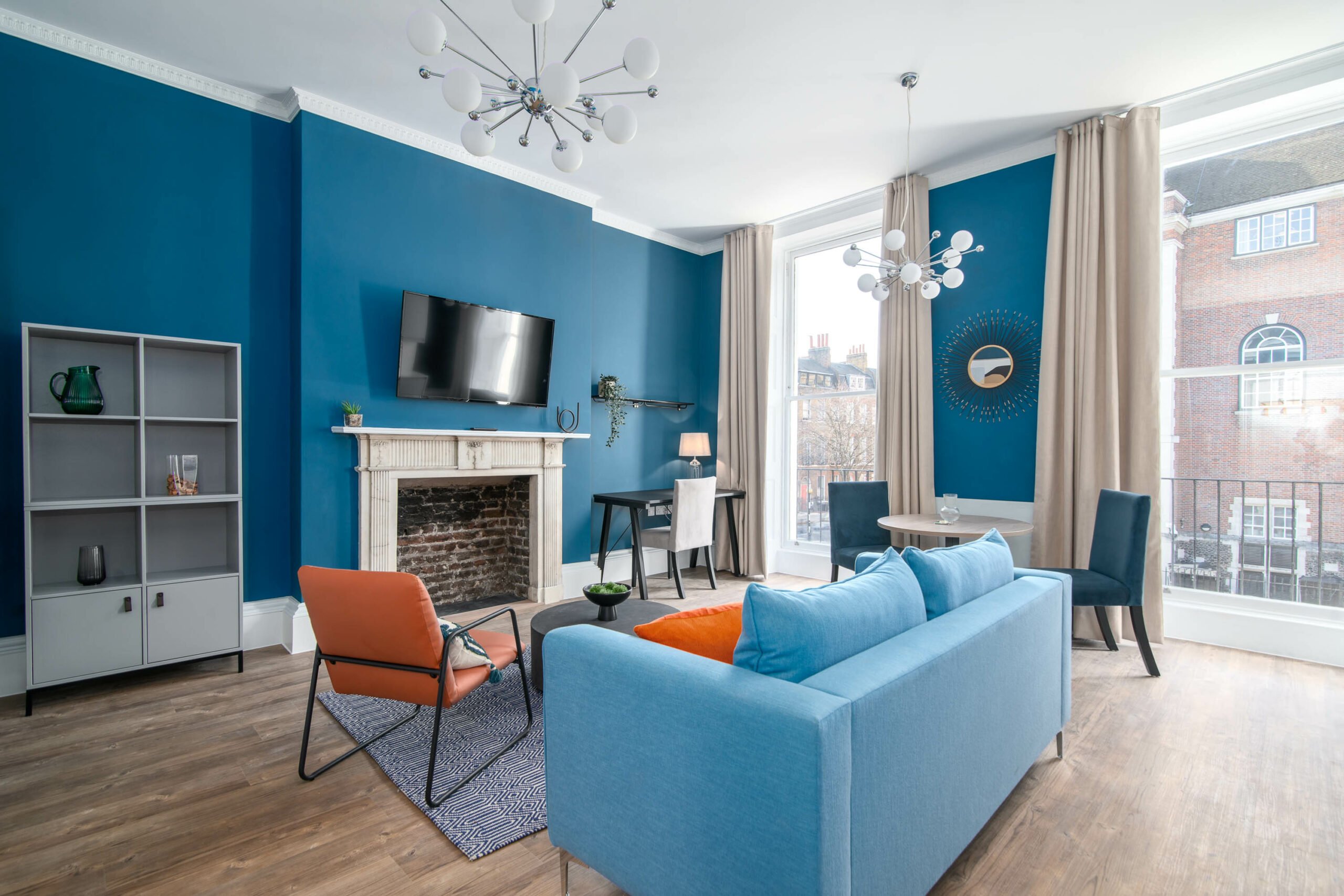 blues with blue feature wall and large sash windows