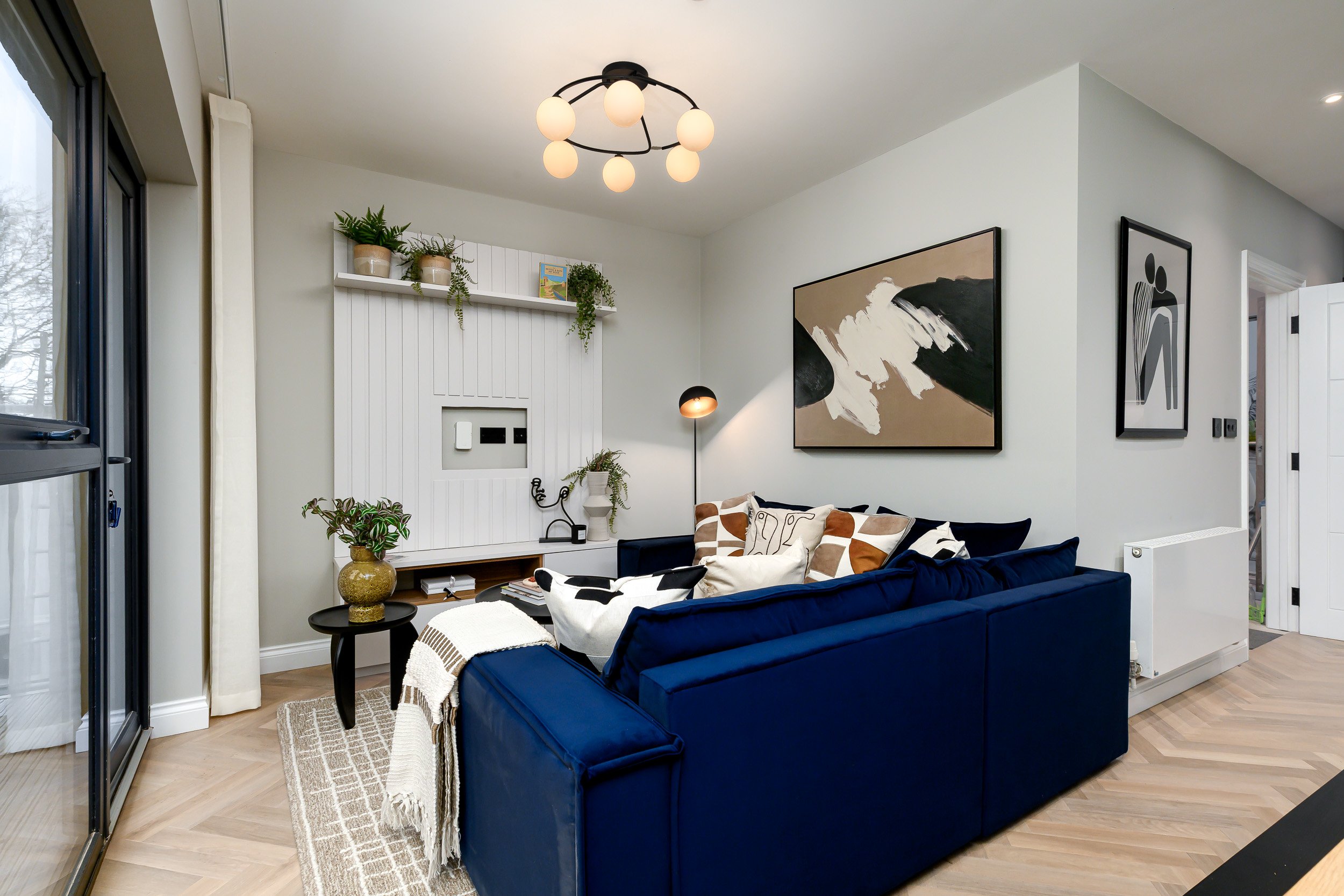 A stylish living room with a blue couch and a blue chair, offering a comfortable and coordinated seating arrangement.